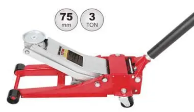 Low-profile aluminum floor jack for sports car repair in home garage.